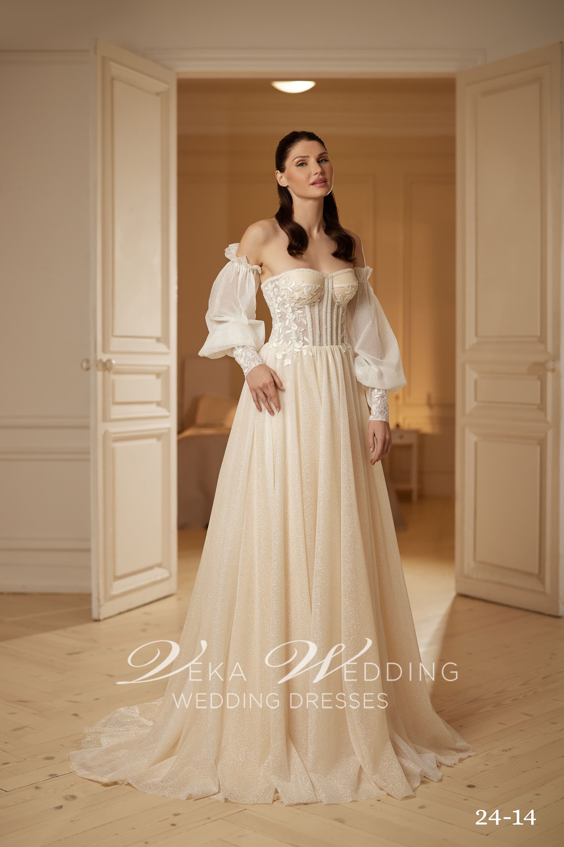 Adeline bridal gown — shimmering A-line silhouette with structured corset and puff sleeves